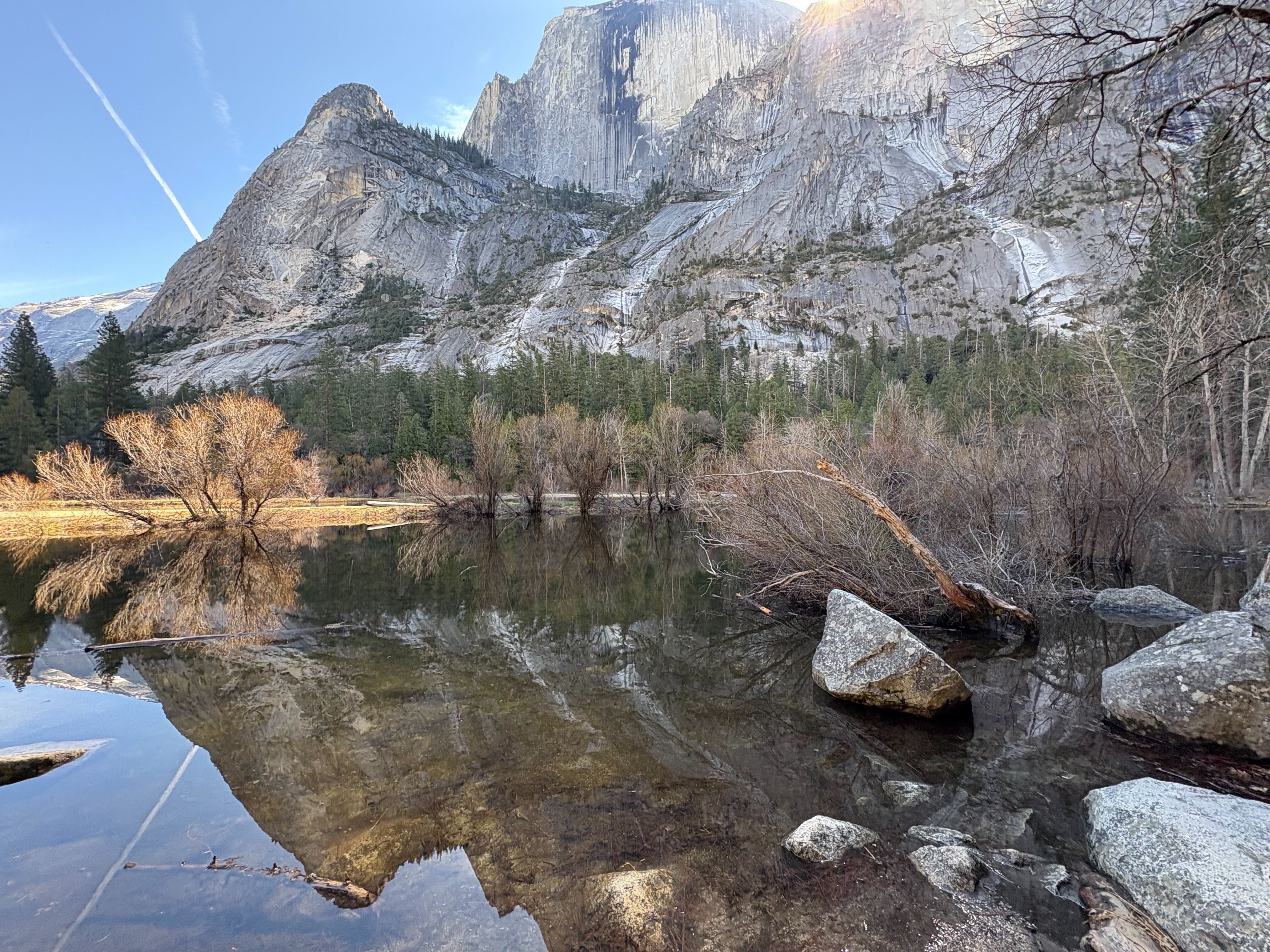 Mirror Lake reflecting Half Dome and the surrounding valley walls.